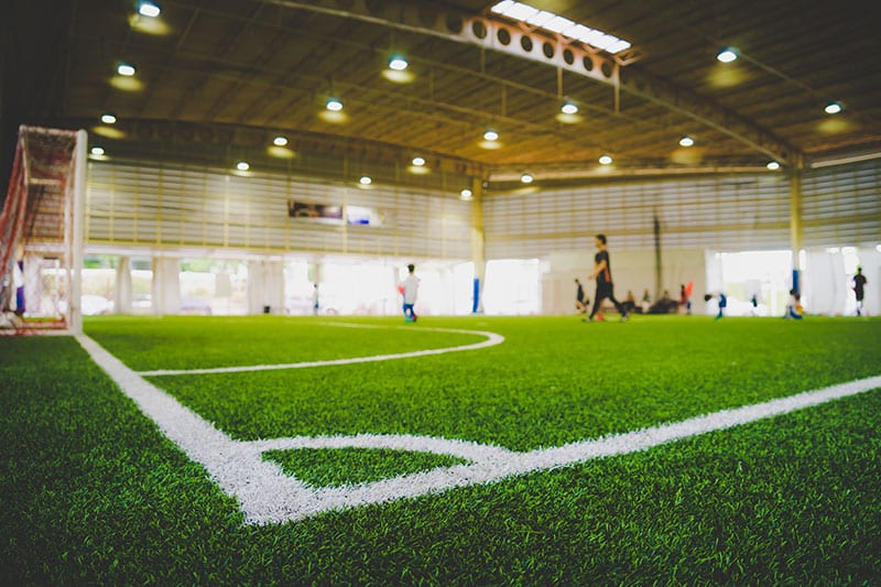 Indoor soccer field covered with lush and vibrant turf grass